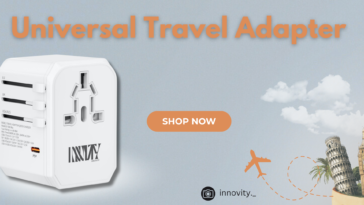 Promotional banner for Innov Markets featuring a universal travel adapter. The adapter is white with multiple plug configurations, marked for EU, UK, and USA/AUS. The text highlights the price "Now At £15.99" and includes a "Shop Now" button. The background showcases landmarks such as Big Ben, the Statue of Liberty, and the Eiffel Tower, along with an airplane graphic. The Innov Markets website (innovmarkets.com) and Instagram handle (@innovity._) are displayed at the bottom.